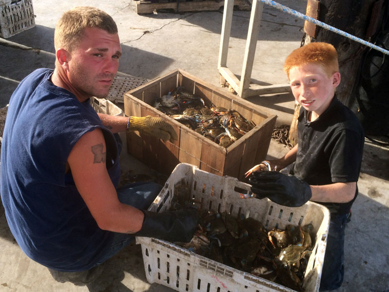Taylor Crawford  and "Peanut" Jones  helping with crabs